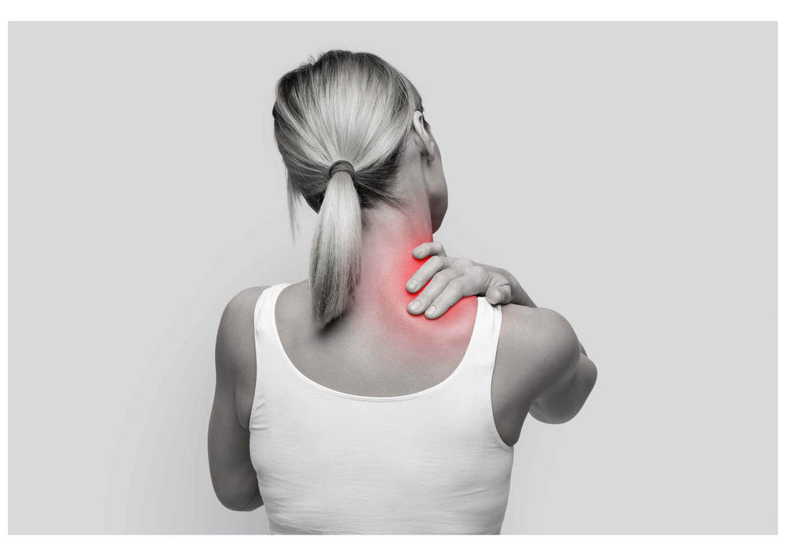 Woman holding her neck in pain