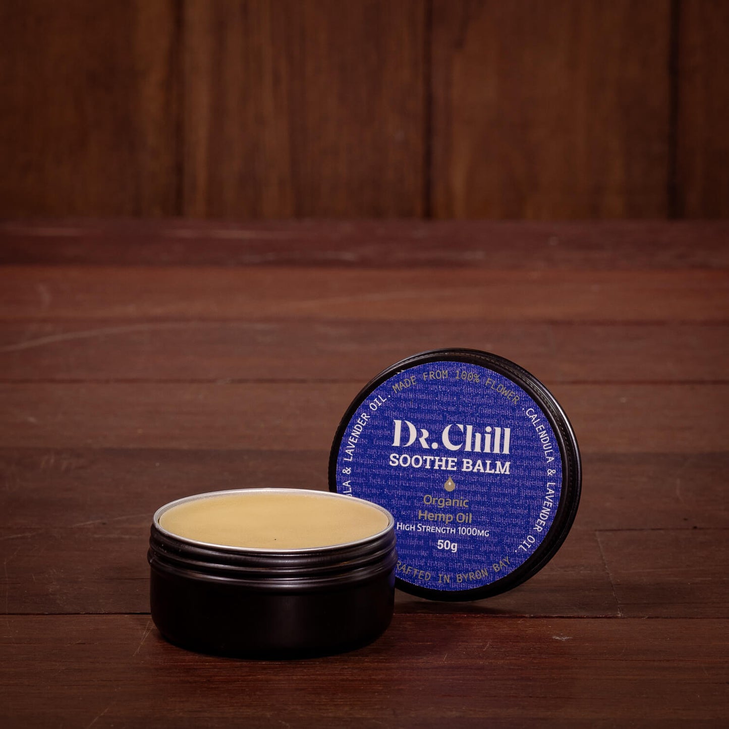 Dr. Chill soothe balm with open container on a wooden surface