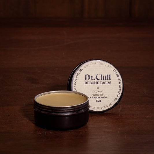 Dr. Chill rescue balm container on a wooden surface