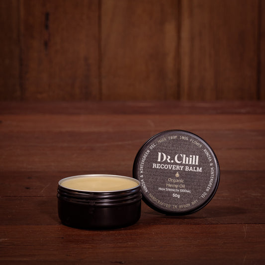 Dr. Chill Recovery Balm jar on a wooden surface